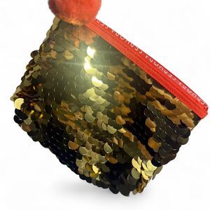 Sephora Gold sequin pouch with orange pom pom